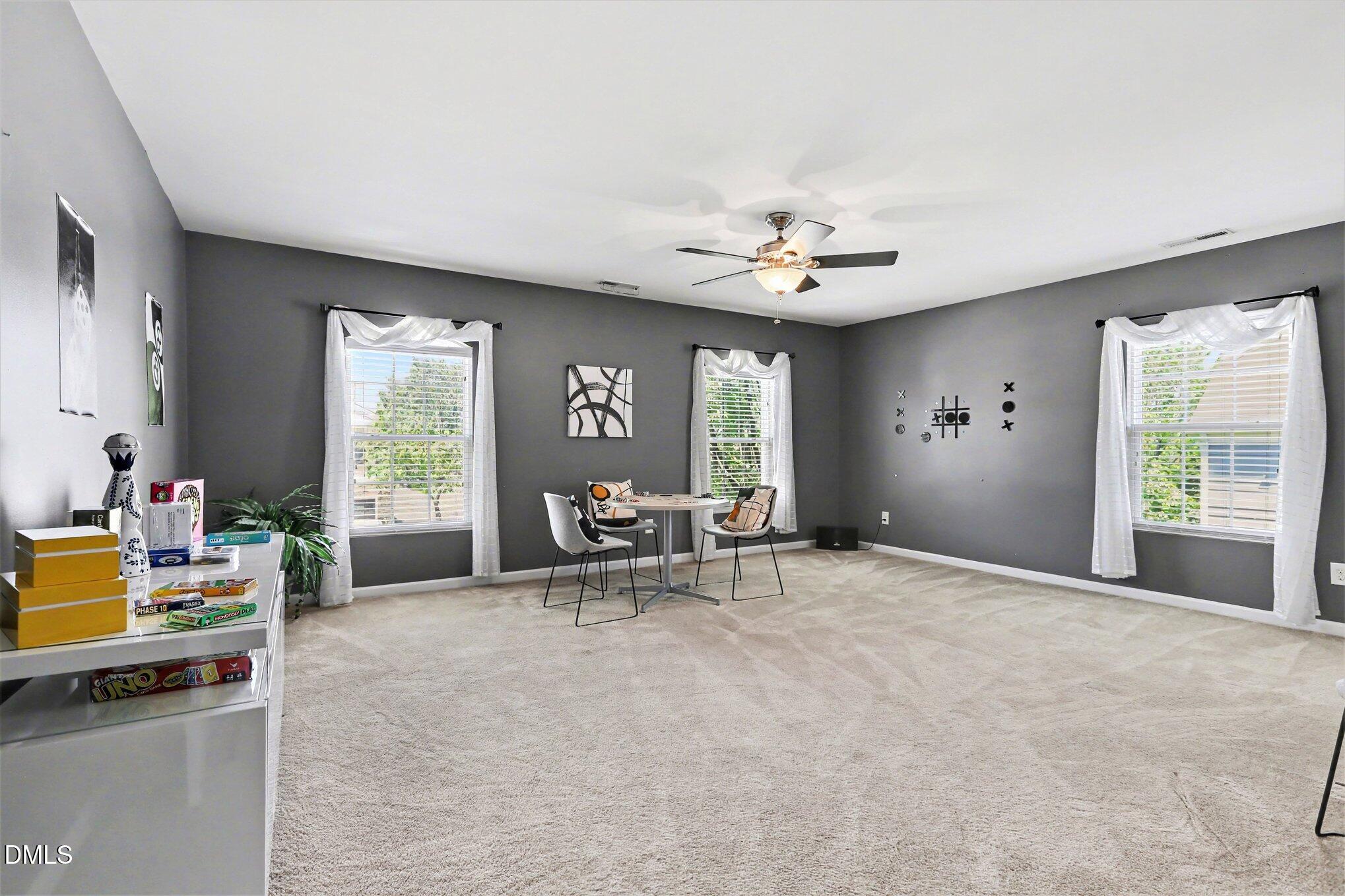 437 Field Glow Lane Apex, NC 27539 - Photo 19 of 48 a view of a livingroom with workspace and a window