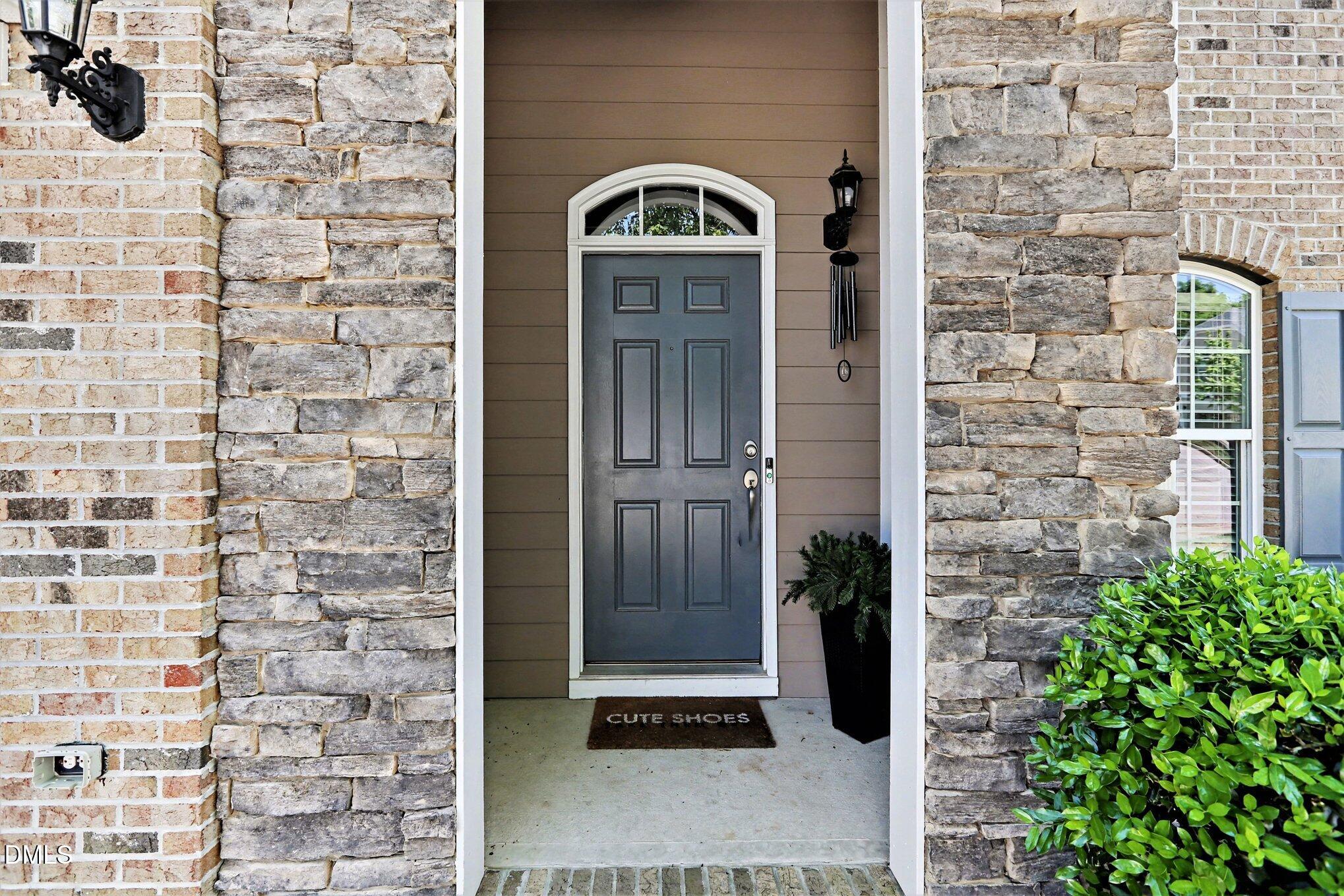 437 Field Glow Lane Apex, NC 27539 - Photo 3 of 48 a view of a door of the building