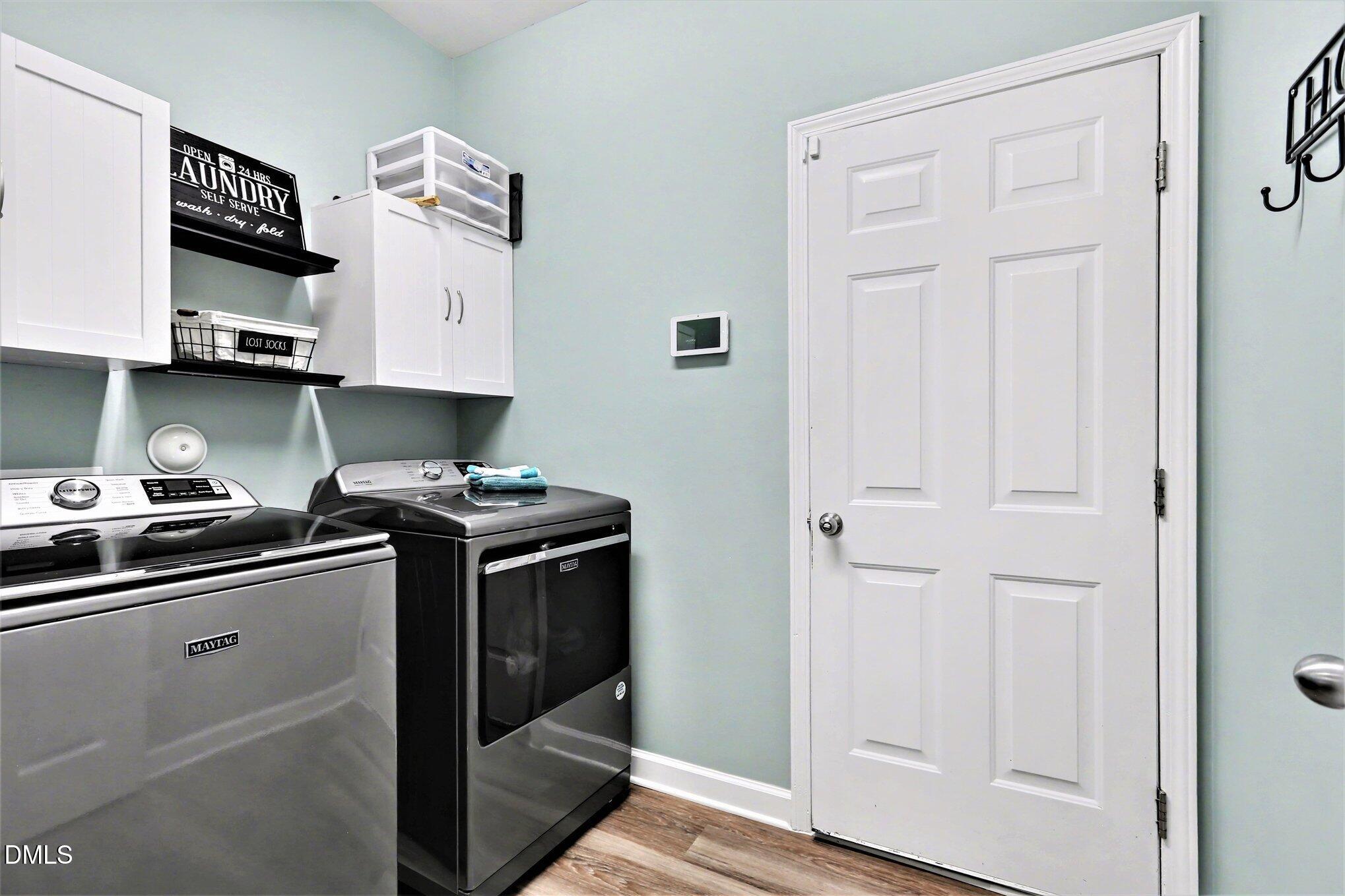 437 Field Glow Lane Apex, NC 27539 - Photo 32 of 48 a kitchen with stainless steel appliances granite countertop a stove and a refrigerator