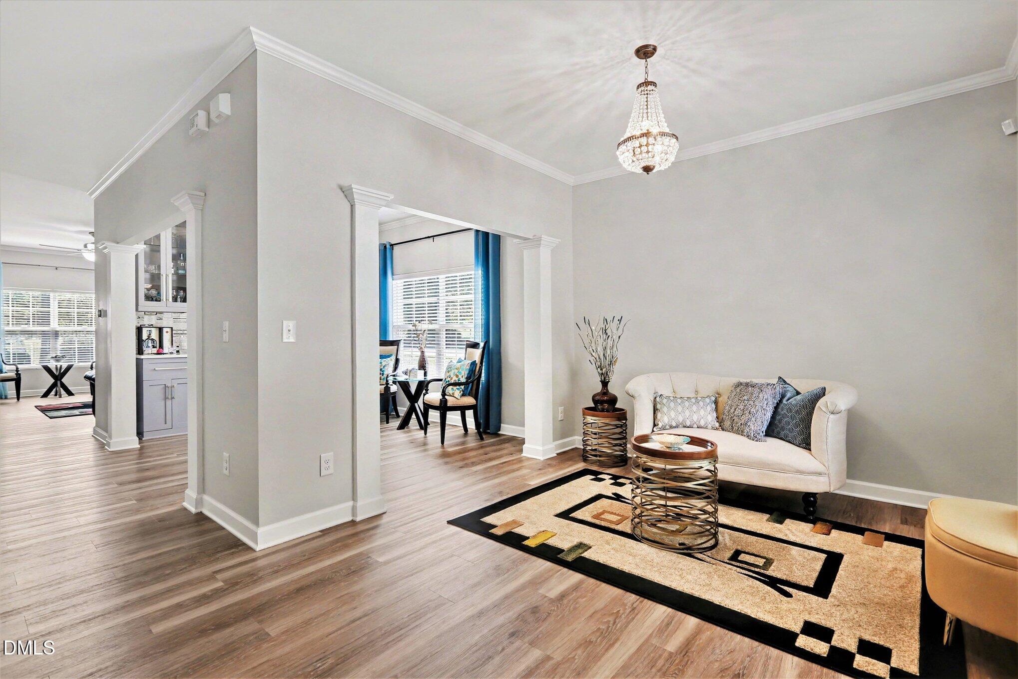 437 Field Glow Lane Apex, NC 27539 - Photo 4 of 48 a living room with furniture and wooden floor