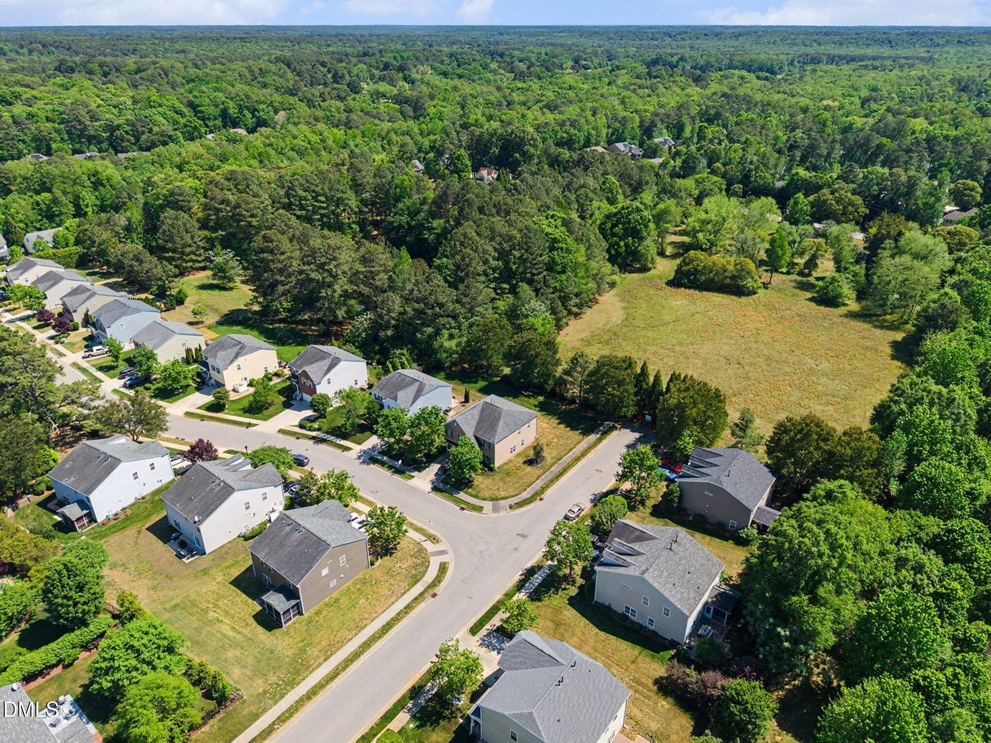 437 Field Glow Lane Apex, NC 27539 - Photo 45 of 48 an aerial view of a house with a yard
