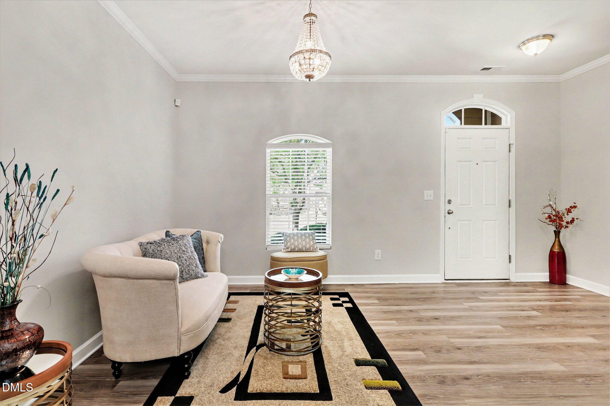 437 Field Glow Lane Apex, NC 27539 - Photo 5 of 48 a living room with furniture and wooden floor