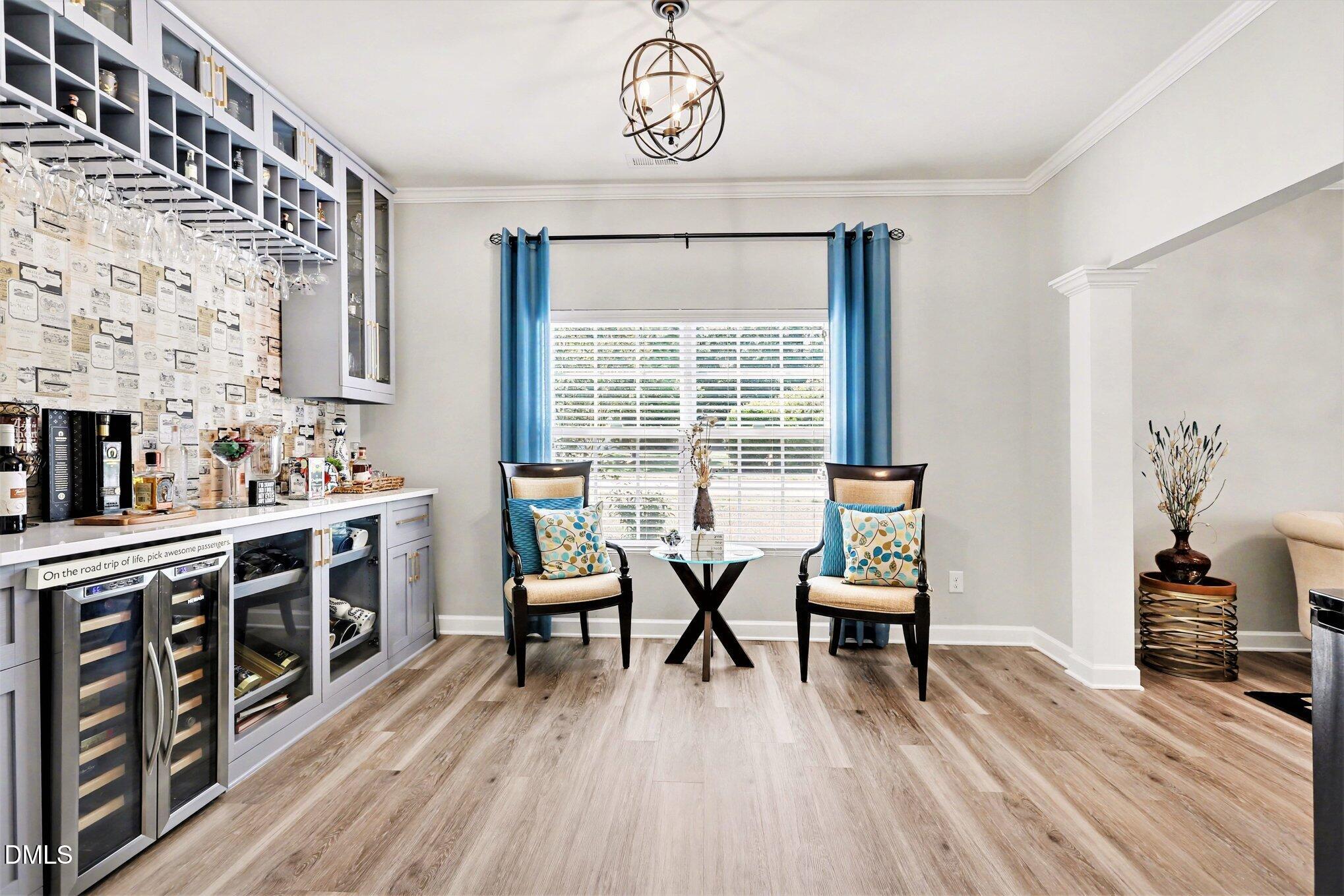 437 Field Glow Lane Apex, NC 27539 - Photo 8 of 48 a view of a dining room with furniture window and wooden floor