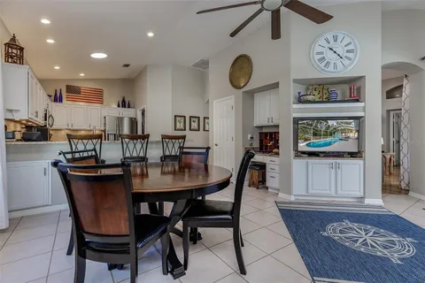 a view of a dining room and kitchen