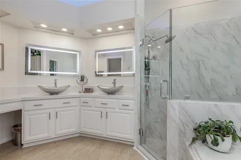 a bath room with a bath tub and a shower