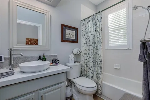 a bathroom with a sink toilet and a bathtub