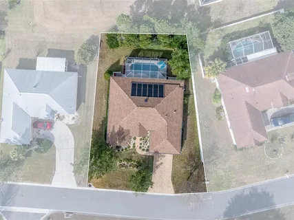 an aerial view of a house with a garden