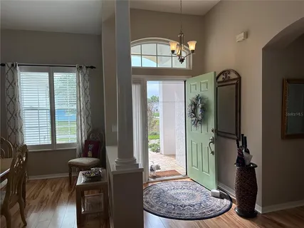 a view of a livingroom with furniture and windows