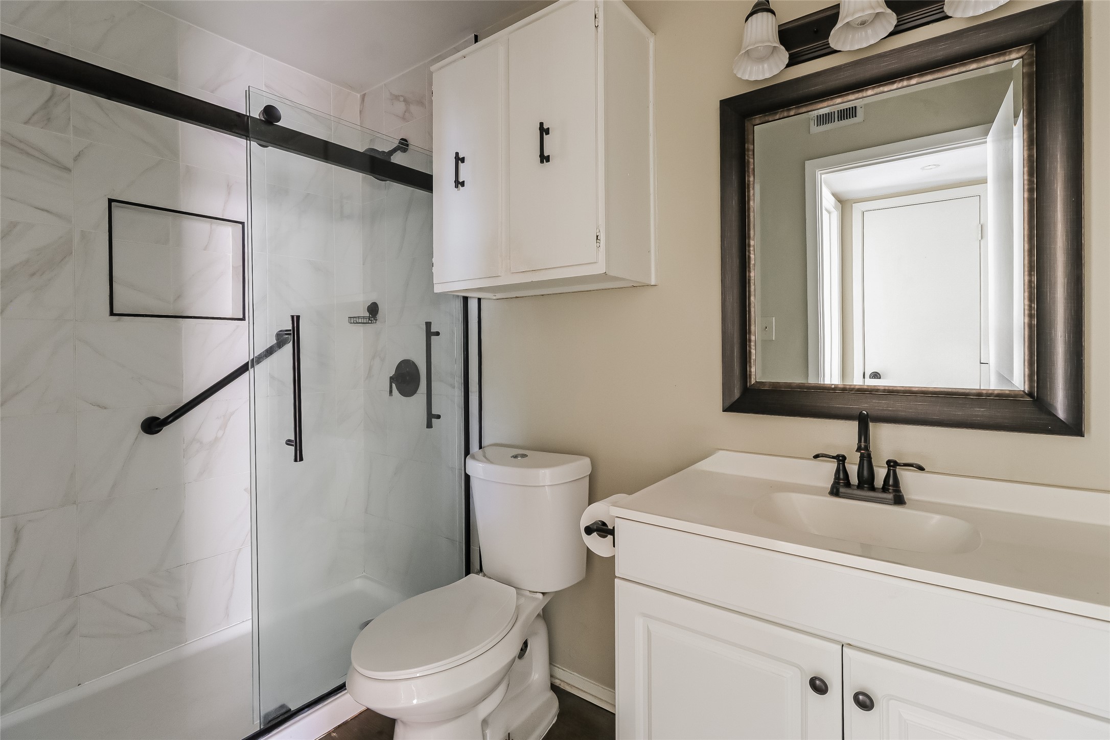 500 East Riverside Drive, Unit 135 Austin, TX 78704 - Photo 13 of 16 Bathroom with vanity and a marble finish shower