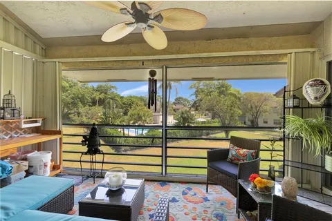 a view of a balcony filled with furniture