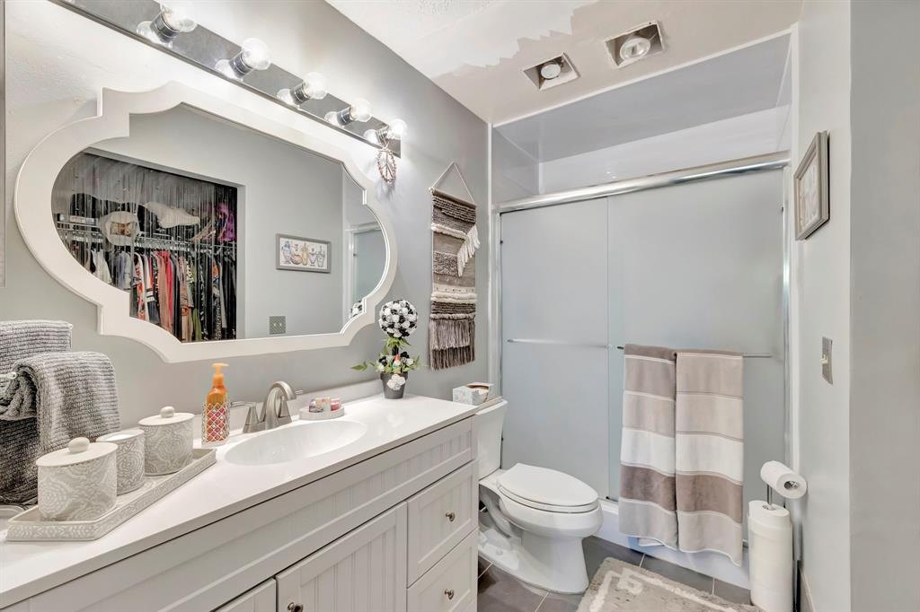 8799 Holly Court, Unit 202 Tamarac, FL 33321 - Photo 20 of 26 a bathroom with a sink a toilet and shower