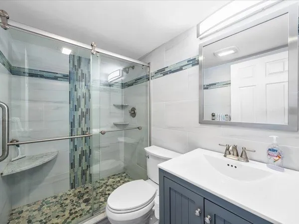 a view of storage and utility room with racks on the wall