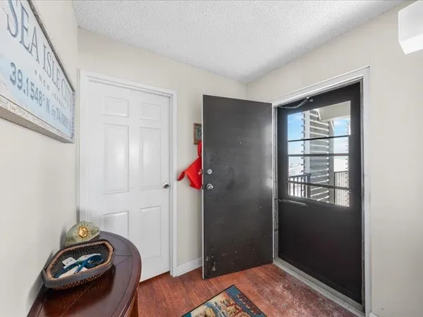 a view of a kitchen with a sink and cabinets
