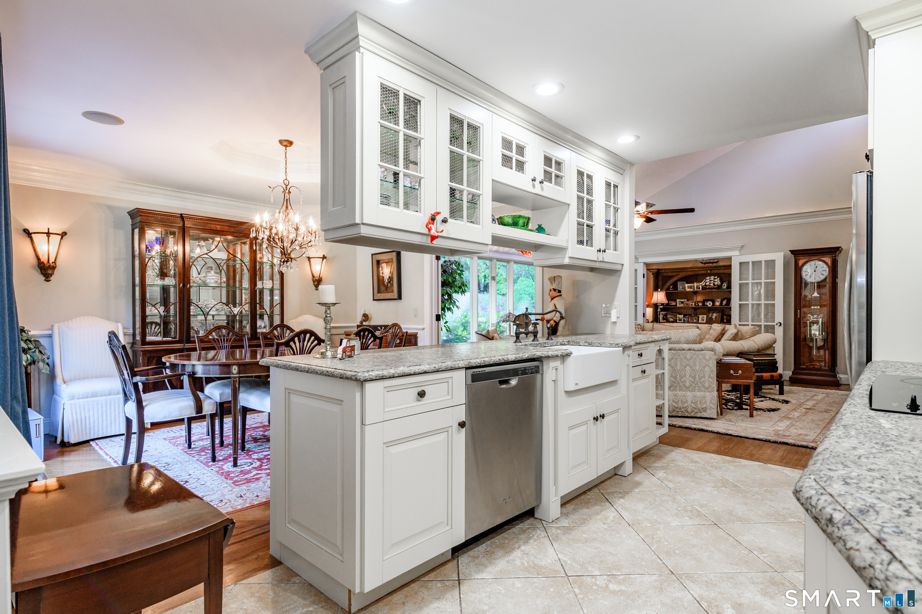 2 Bramble Bush, Unit 2 Avon, CT 06001 - Photo 11 of 40 a kitchen with cabinets and chairs in it