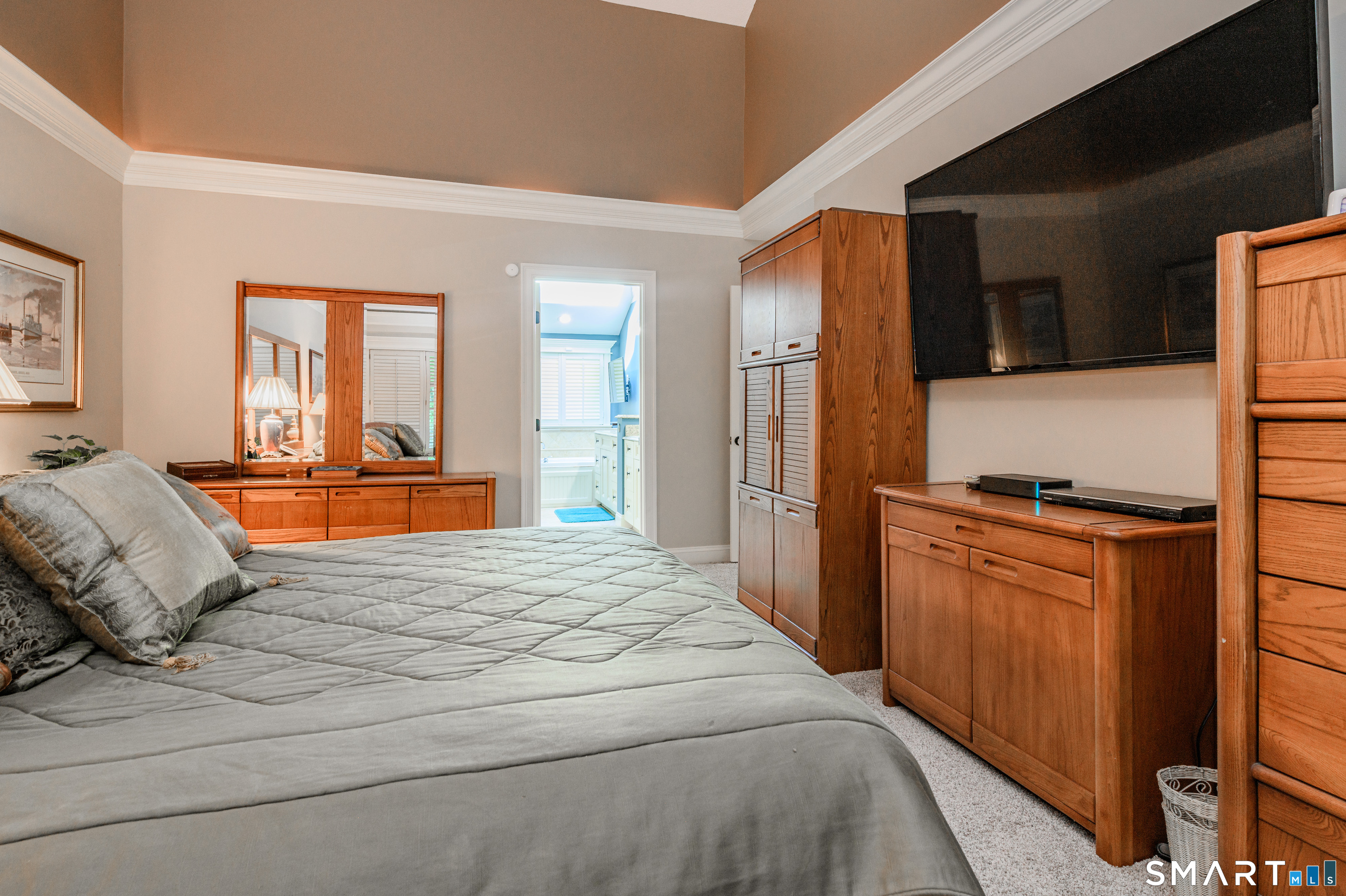 2 Bramble Bush, Unit 2 Avon, CT 06001 - Photo 21 of 40 a bedroom with a bed and wooden floor