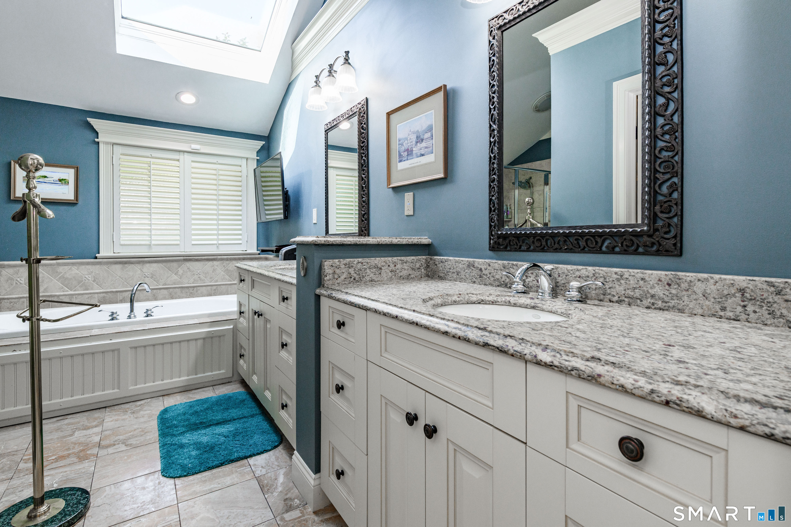 2 Bramble Bush, Unit 2 Avon, CT 06001 - Photo 22 of 40 a bathroom with a granite countertop sink mirror and a