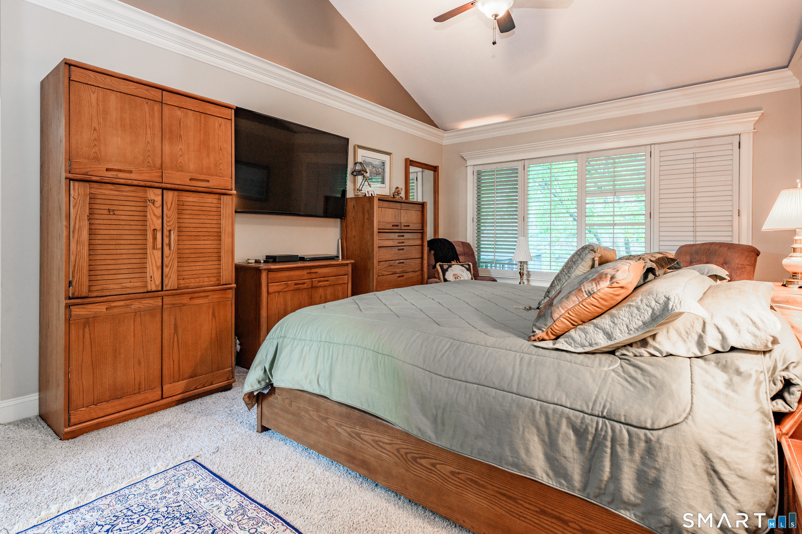 2 Bramble Bush, Unit 2 Avon, CT 06001 - Photo 24 of 40 a bedroom with a bed dresser and a flat screen tv