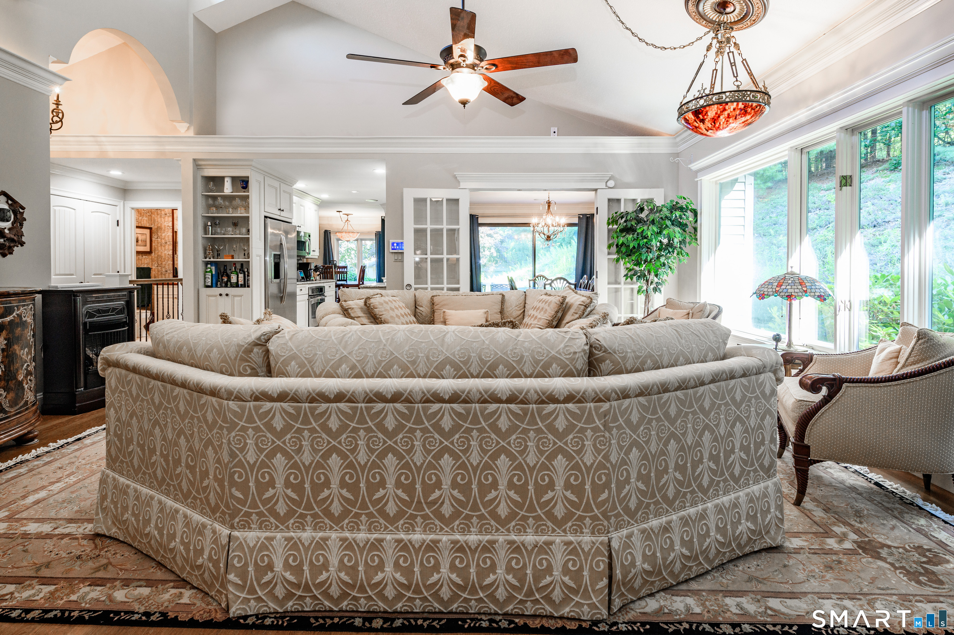 2 Bramble Bush, Unit 2 Avon, CT 06001 - Photo 3 of 40 a living room with furniture and a chandelier