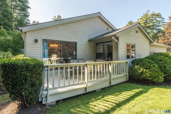a view of a house with a yard balcony and garden