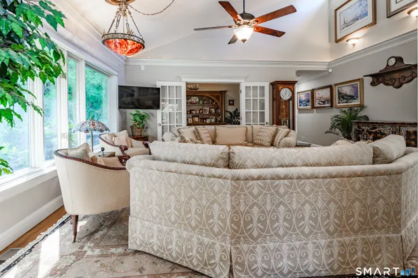 a living room with furniture and a large window