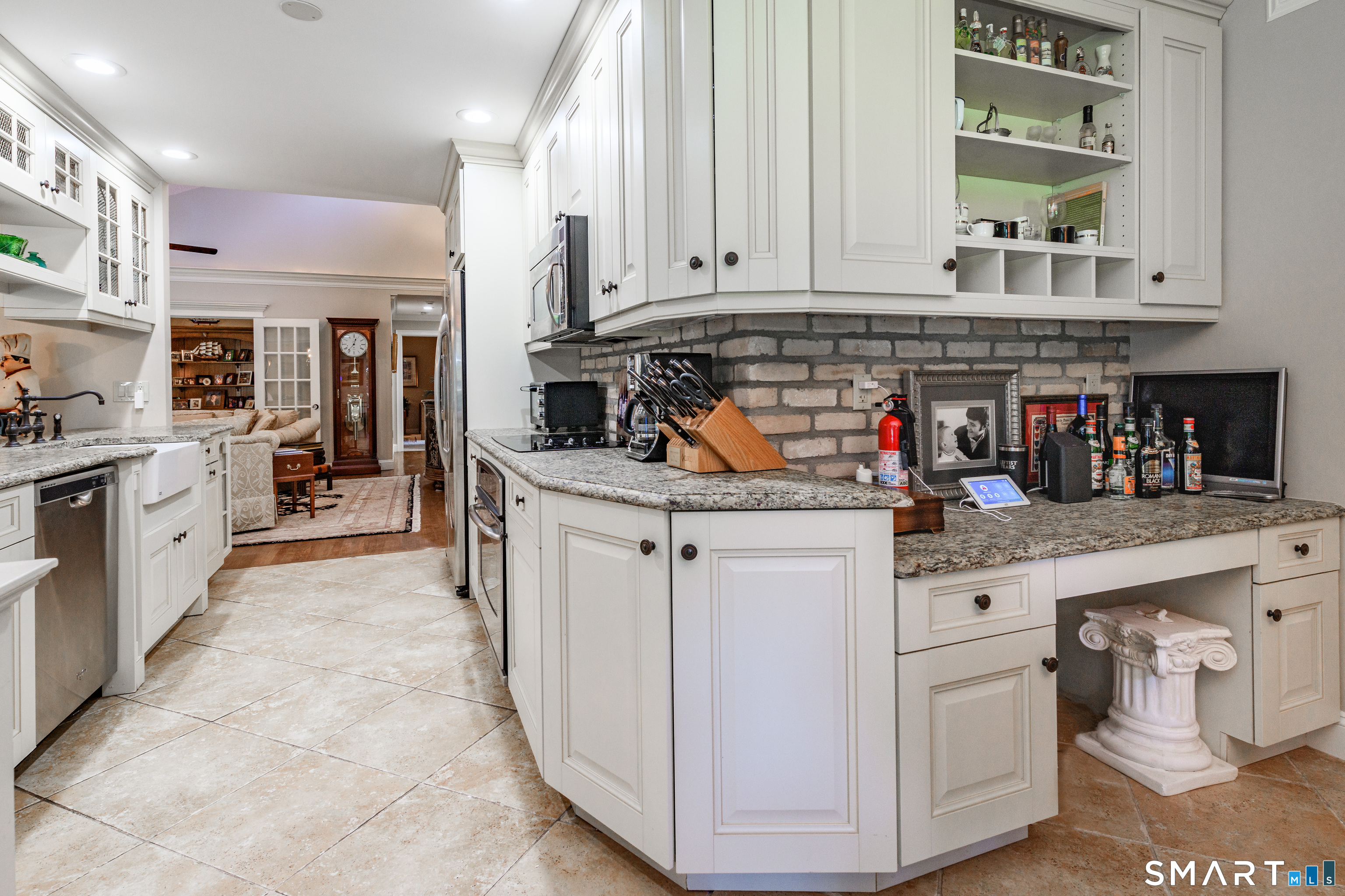 2 Bramble Bush, Unit 2 Avon, CT 06001 - Photo 10 of 40 a kitchen with stainless steel appliances granite countertop a stove and cabinets