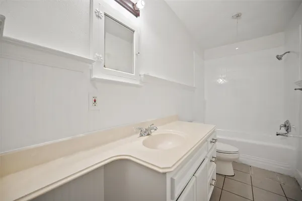 a bathroom with a sink a toilet and vanity