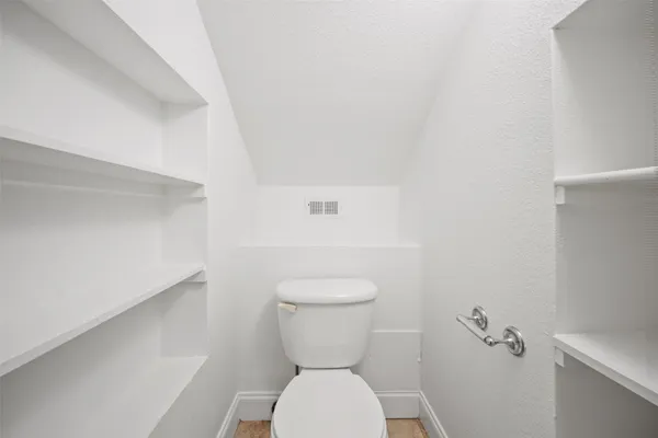 a bathroom with a toilet and a sink