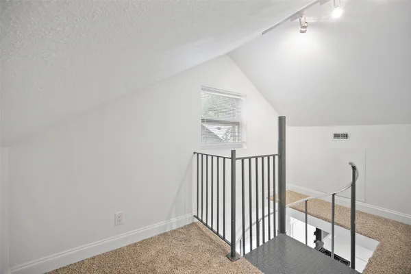 a view of a hallway with windows