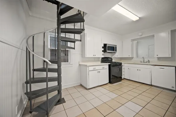 a kitchen with a cabinets and appliances