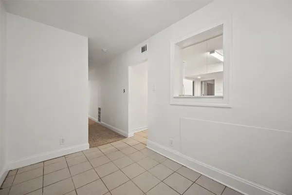 a view of an empty room with window