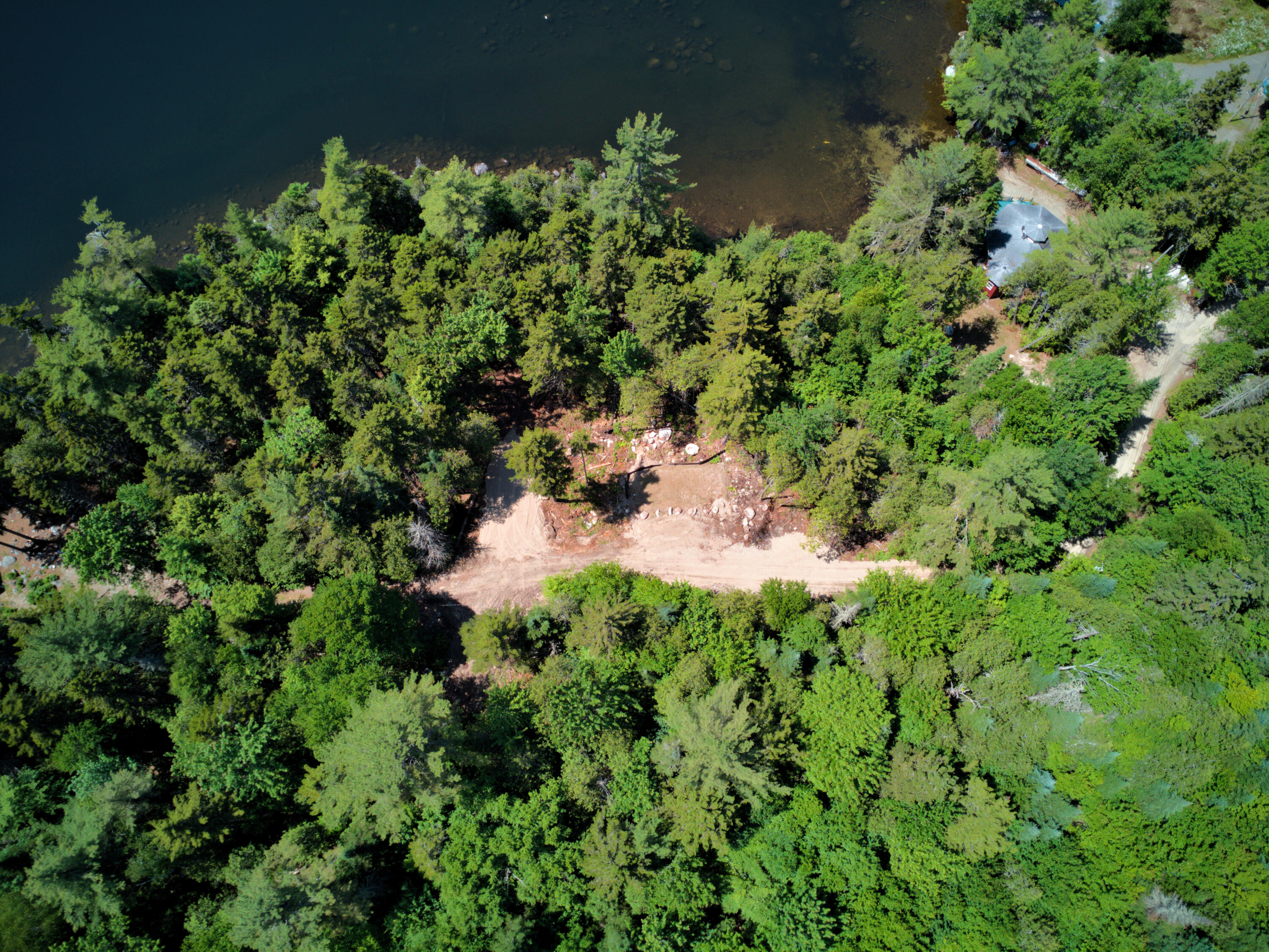 Lot Cl29 Lot Cl29 Cozy Corner Millinocket, ME 04462 - Photo 7 of 28 BEHIND_LOT_TO_WATER_DJI_0193-hdr_E_01
