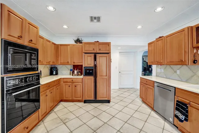 a bedroom with furniture and a large window