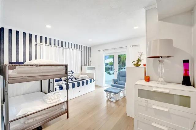 a bathroom with a granite countertop sink a toilet and a mirror