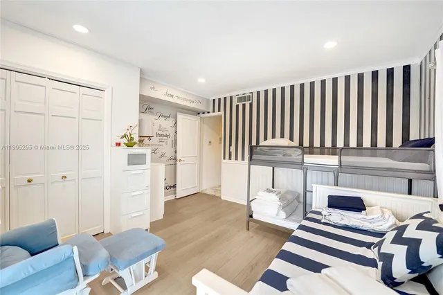 a bedroom with a large bed and a large window