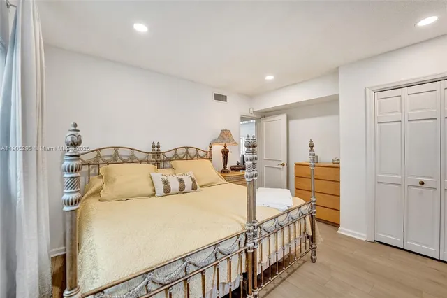 a bathroom with a granite countertop toilet a sink and a shower