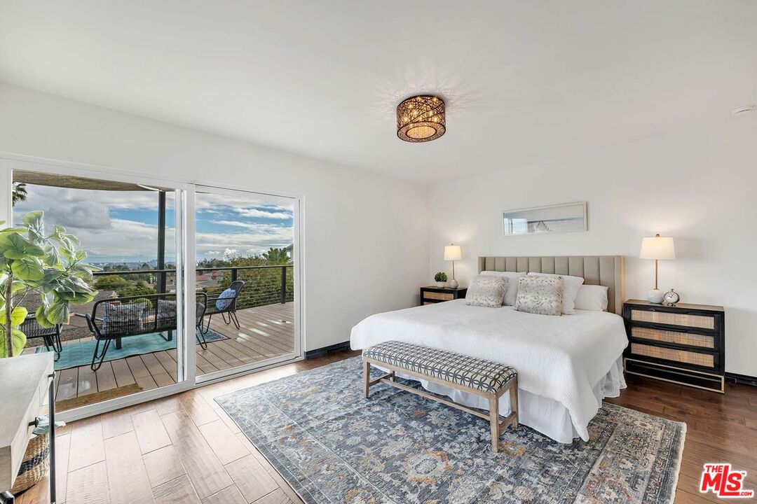 2050 Glentree Drive Lomita, CA 90717 - Photo 13 of 36 a bedroom with a bed and a table