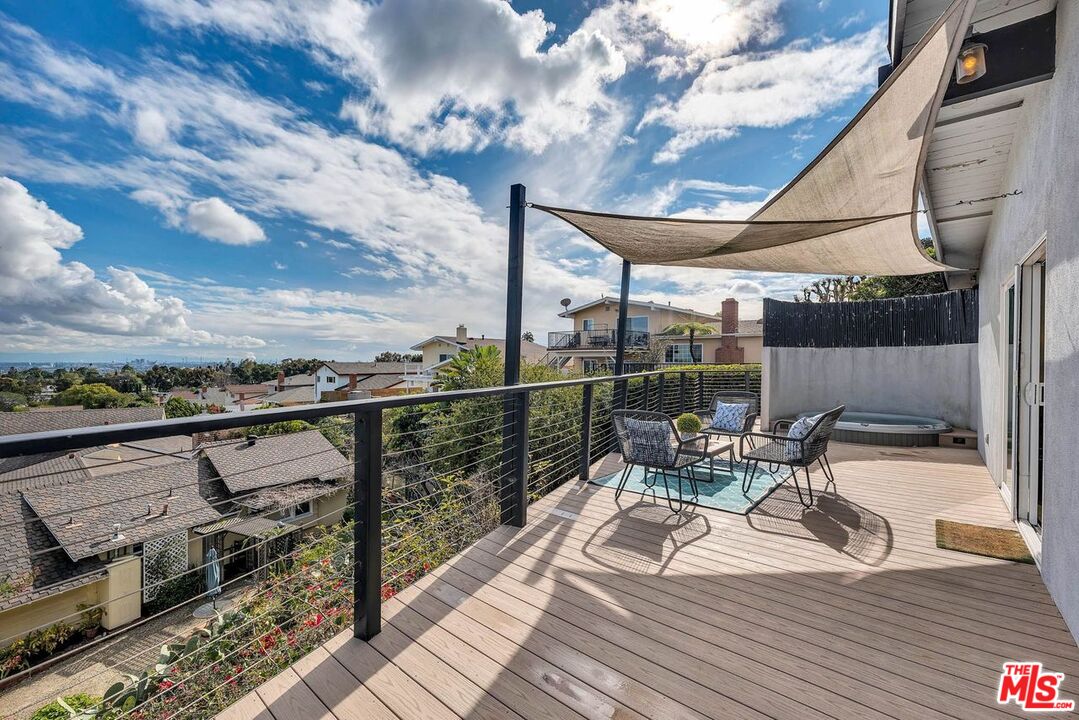 2050 Glentree Drive Lomita, CA 90717 - Photo 28 of 36 a view of a balcony with chairs and wooden floor