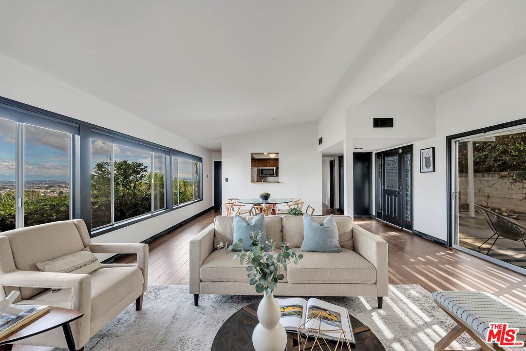 2050 Glentree Drive Lomita, CA 90717 - Photo 6 of 36 a living room with furniture large window and flat screen tv