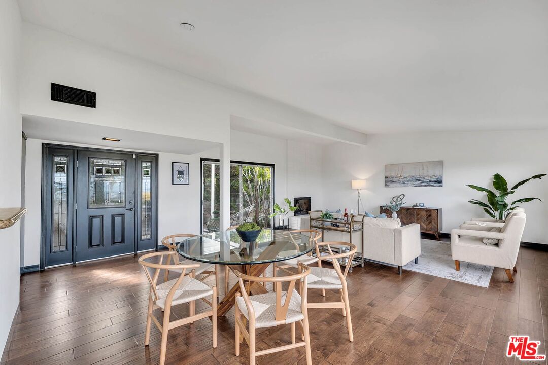 2050 Glentree Drive Lomita, CA 90717 - Photo 7 of 36 a living room with furniture a large window and wooden floor