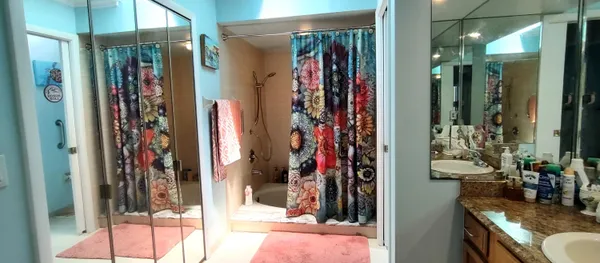 a view of a living room and bathroom