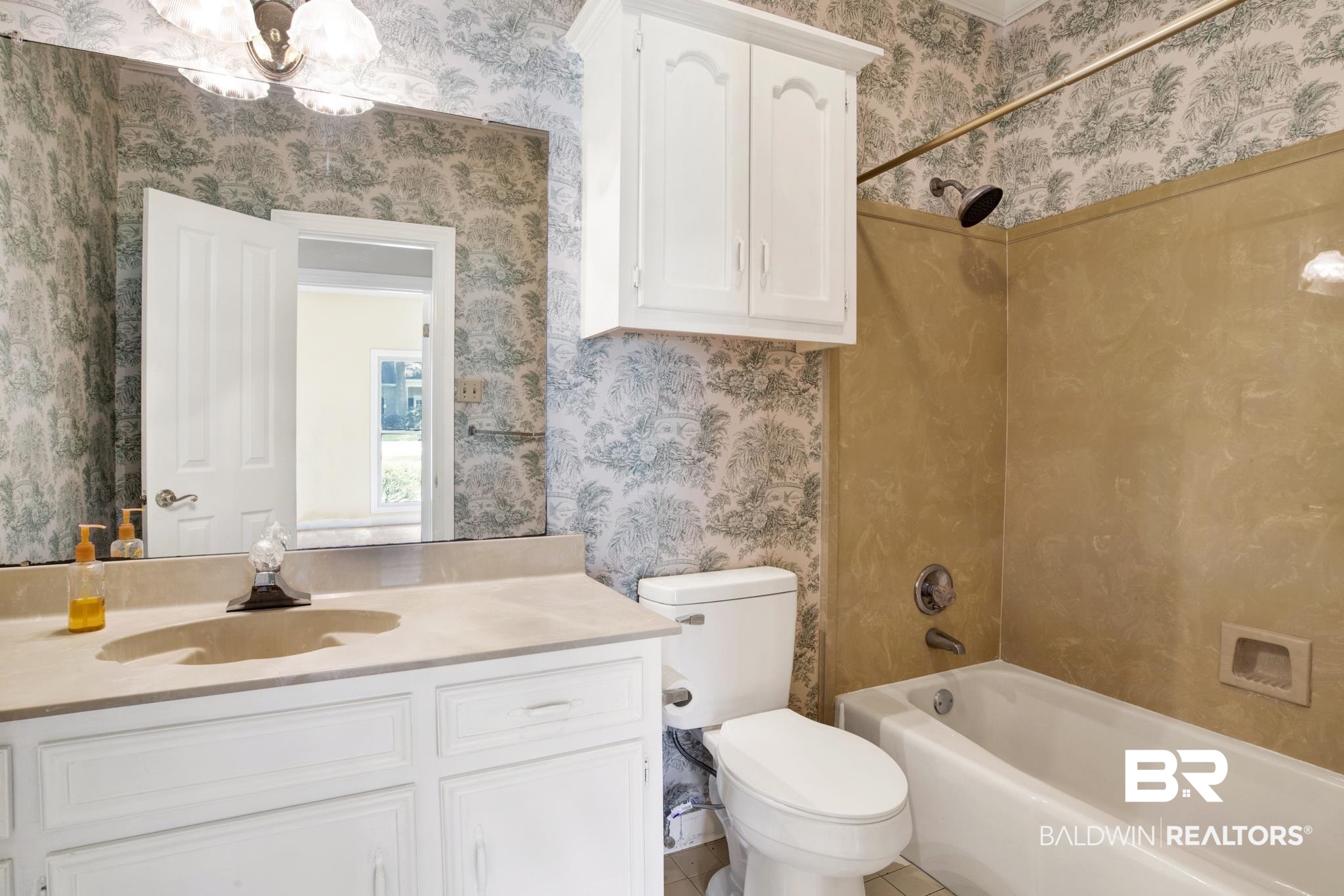 6805 Hunters Court Mobile, AL 36695 - Photo 29 of 37 Bathroom with wallpapered walls, vanity, toilet, bathing tub / shower combination, and a chandelier