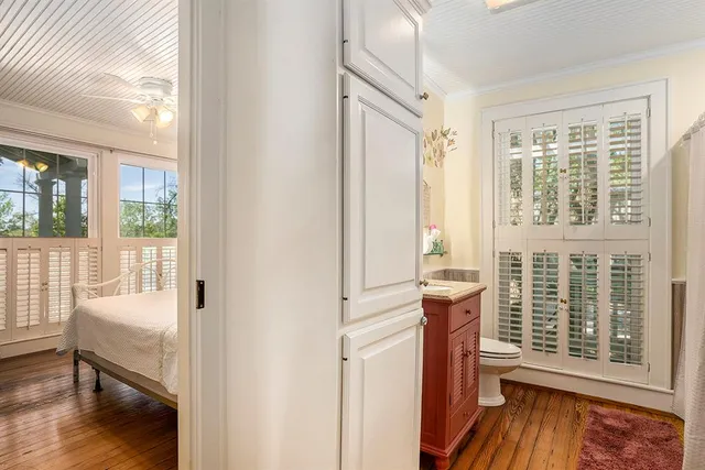 a bedroom with a bed and a television