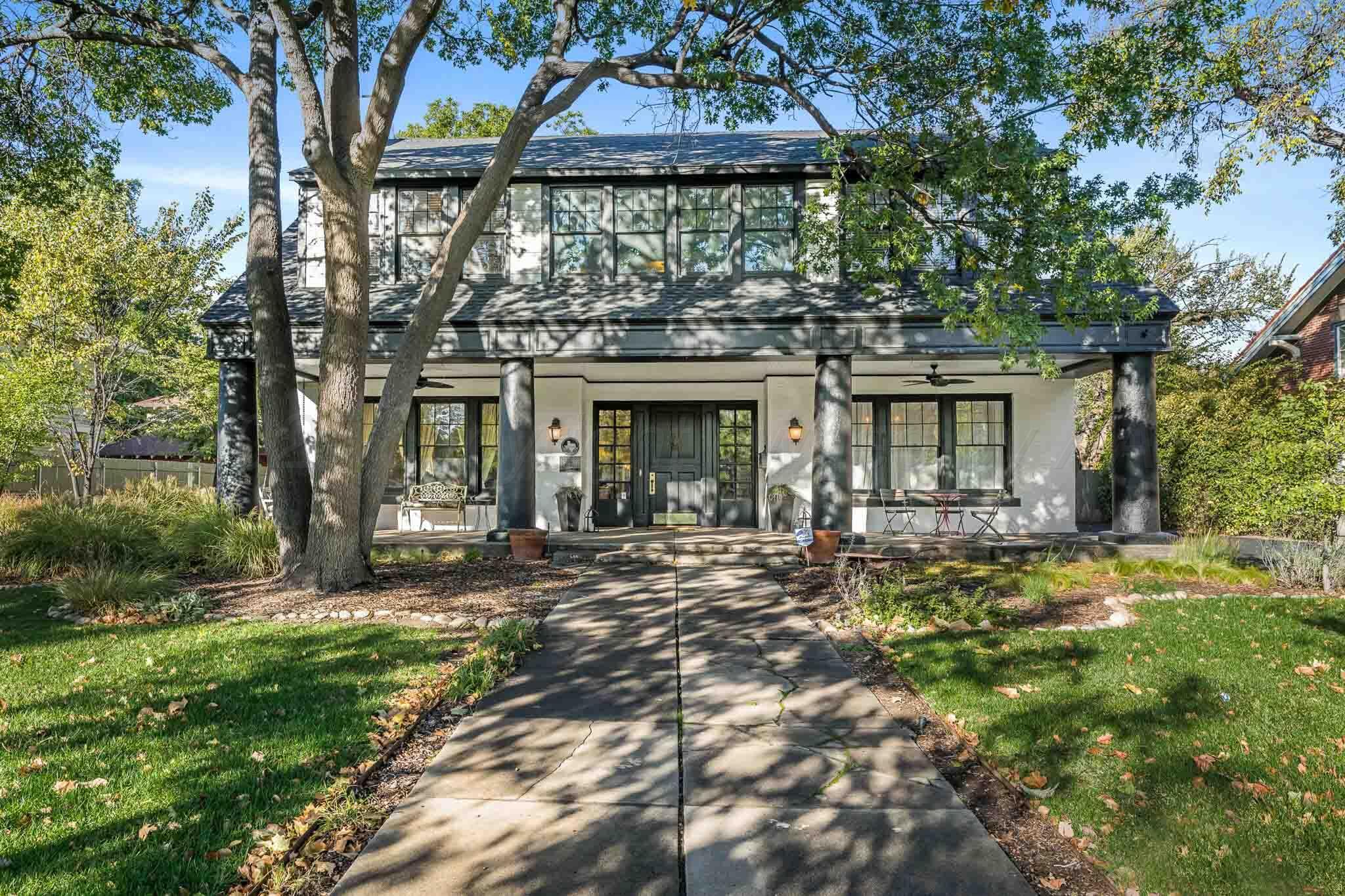 1706 South Polk Street Amarillo, TX 79102 - Photo 1 of 38 a front view of a house with a garden
