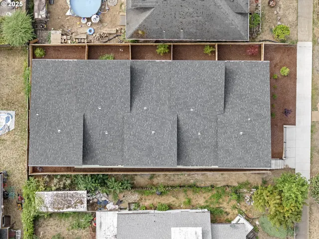 an aerial view of a house having yard