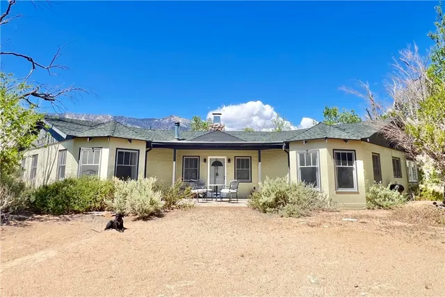 front view of a house with potted plants