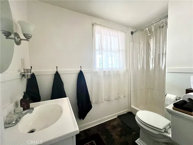 a bathroom with a toilet and a sink