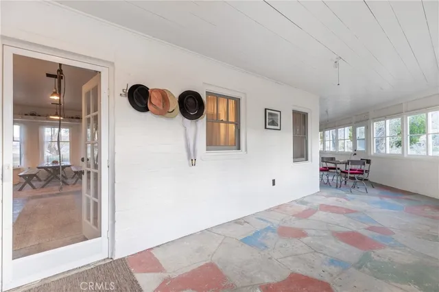 a view of a livingroom with a dinning area hardwood floor and a ceiling fan
