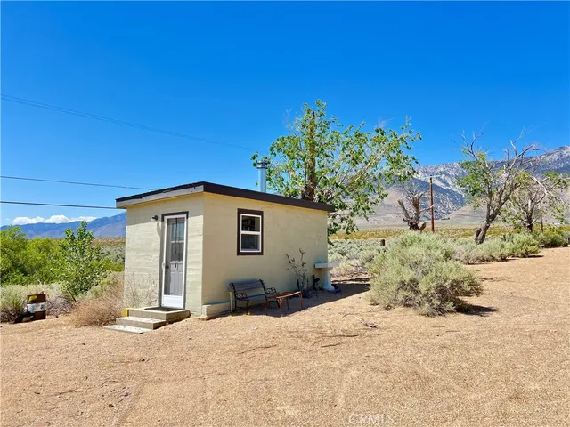 a view of a chairs and table in the patio