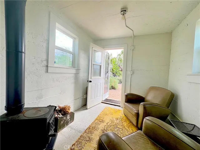 a view of a chairs and table in backyard