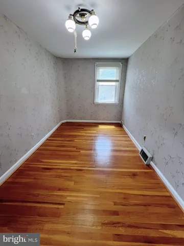 a room with lots of painting on the wall